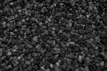 Natural black coals for background design. Industrial coals. Volcanic rock energy on earth.