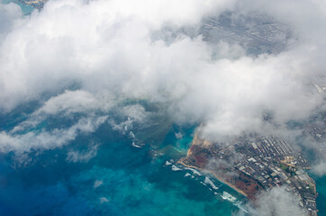 city  and blue ocean under cloud