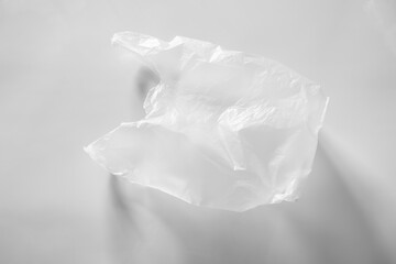 Empty plastic bag isolated on white background. Illustration of reducing plastic bags to help reduce global warming