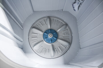 Empty Drum washing machine. Easy washing necessary household for washing textiles, bed, underwear, linen, bags and other things.