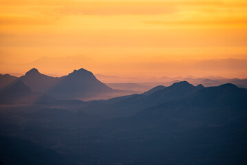 Landscape sunrise or sunset on the mountain beautiful sky yellow orange, Mountain valley during sunrise natural summer landscape
