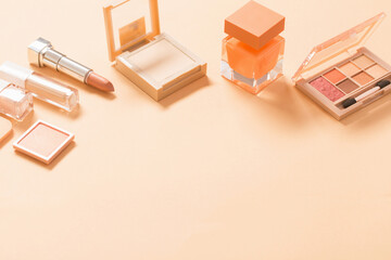 decorative cosmetics with perfume  on pastel  background