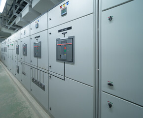 Interior of electrical room. Power energy motor machinery cabinets in control or server room, main operator station network and circuit center in industry factory manufacturing system. generator