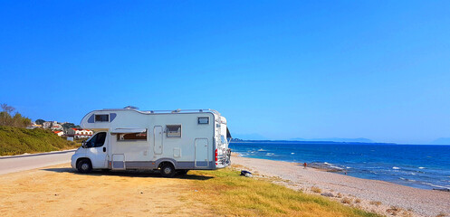caravan trailer car by the sea in summer holidays - obrazy, fototapety, plakaty