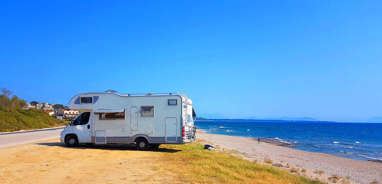 caravan trailer car by the sea in summer holidays