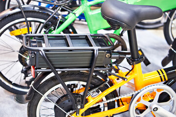 Fototapeta na wymiar Lithium ion battery on bicycle luggage carrier