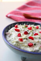 Pomegranate and Cucumber Raita. Indian Fresh sauce or condiment called Raita. Yogurt mixed with...