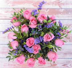 Bouquet of roses on the table top view. Holiday concept. Flowers bdckground. Flowers card.