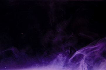 Ink swirls underwater. Ink cloud isolated on black background. Abstract effect of explosion of cosmos universe smoke with particles.