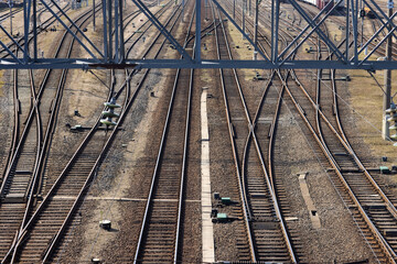Rusty railroad tracks on gravel. Top view of railways on a sunny day