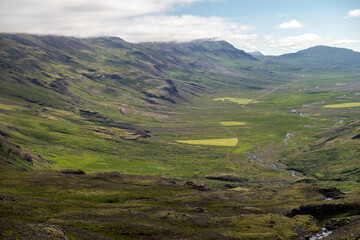 Majestic volcanic landscape covered with moss in Iceland highlands
