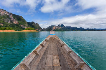raditional longtail boat with beautiful scenery view in Ratchaprapha Dam at Khao Sok National Park