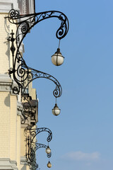 Wall lanterns on a facade of the opera building in Kyiv Ukraine