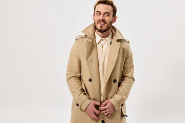 man in beige coat emotions studio modern style isolated background