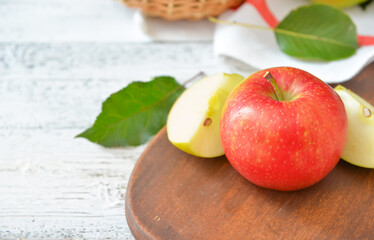 Board with tasty apple and pear fruits on table