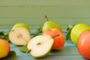 Tasty apple and pear fruits on table