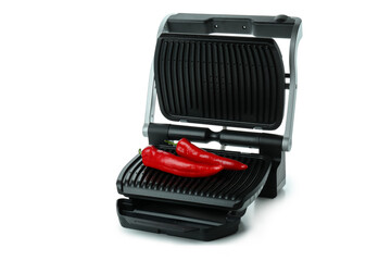 Electric grill with chili peppers isolated on white background