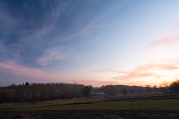 Rural landscape. Sunset over the field in spring