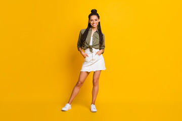 Fototapeta na wymiar Photo portrait full body view of confident girl with two hands in pockets isolated on vivid yellow colored background