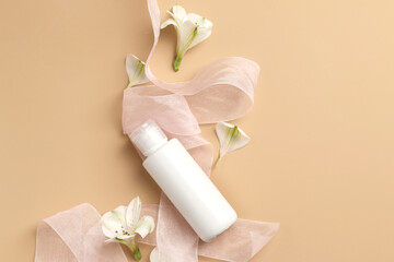 tender flatlay composition with cream, flowers on yellow background. Concept beauty natural vitamin cosmetic product, skin care, top view, copyspace, banner