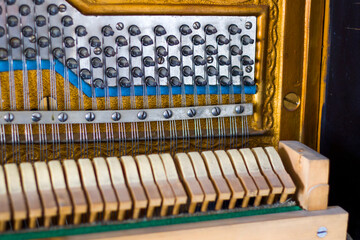 Naklejka premium Piano instrument inside, antiquary piano and old mechanism