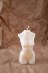 Scented Woman torso candle. Aroma candle in the form of a female shape. Vertical shot