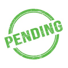 PENDING text written on green grungy round stamp.