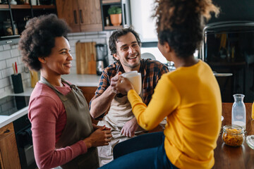 Multi ethnic family in love together in kitchen