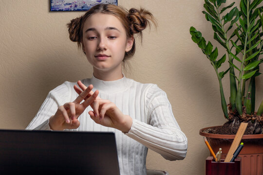 Teenage Girl Deaf Disabled Child School Girl Learning Online Class On Laptop Communicating With Teacher By Video Conference Call Using Sign Language Showing Hand Gesture