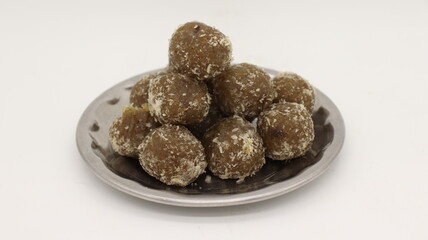 Amla Ladoo, pure and health sweets which use for traditional and regular use amla laddoo contain of natural amla and sugar, garnesing with coconut.