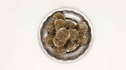 Amla Ladoo, pure and health sweets which use for traditional and regular use amla laddoo contain of natural amla and sugar, garnesing with coconut.