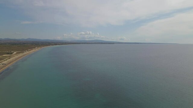 4k steady clip over a peninsula on  the tropical beach of Epanomi, Halkidiki, Greece