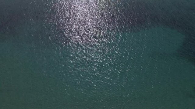 4k tilt up clip of the ocean over a peninsula on  the tropical beach of Epanomi, Halkidiki, Greece