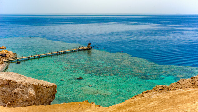 sunny panorama of ras um el sid bay in sharm el sheikh with sea, reef and beaches