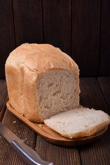 Hot homemade bread. Baking from a bread machine. Minimalism.