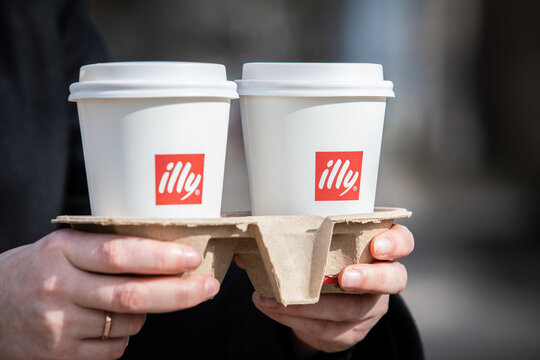Two paper cups of Illy coffee, brand of Italian coffee roasting company . Founded by Francesco Illy in 1933.