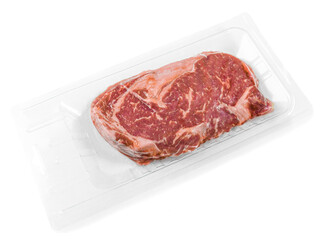 Marbled beef steak. Vacuum packed. View from above. White background. Isolated.