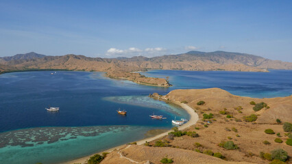 Scenic landscape view of Gili Lawa Darat with Komodo island in background, Komodo National Park, Flores, East Nusa Tenggara, Indonesia © Cyril Redor