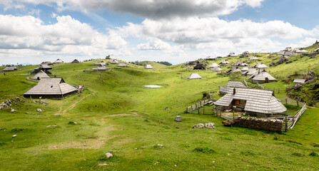 Mountain cottage hut or house on idyllic hill Velika Planina.