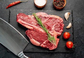 raw T-Bone Beef Steak on stone background