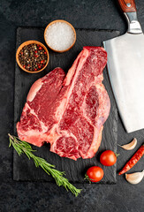raw T-Bone Beef Steak on stone background