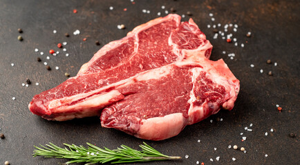 raw T-Bone Beef Steak on stone background