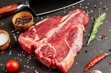 raw T-Bone Beef Steak on stone background