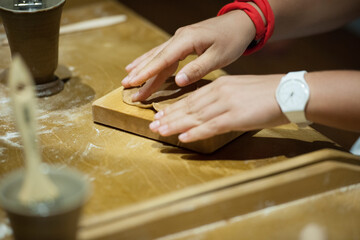 Fototapeta na wymiar Chef woman hands making pasta. Cooking process. Raw food photography concept