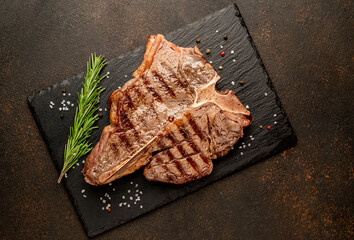 Grilled T-Bone Beef Steak on a stone background