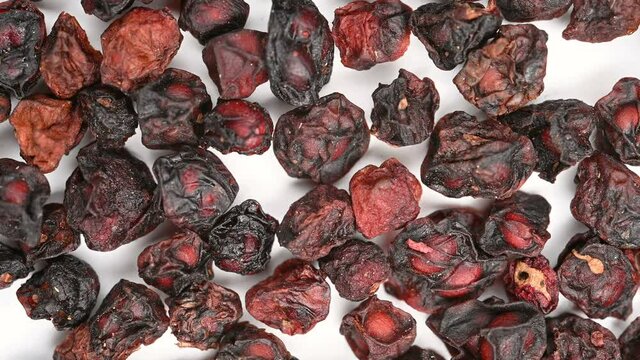 top view herb WuWeiZi or Schisandrae Chinensis Fructus or Chinese Magnoliavine Fruit rotating