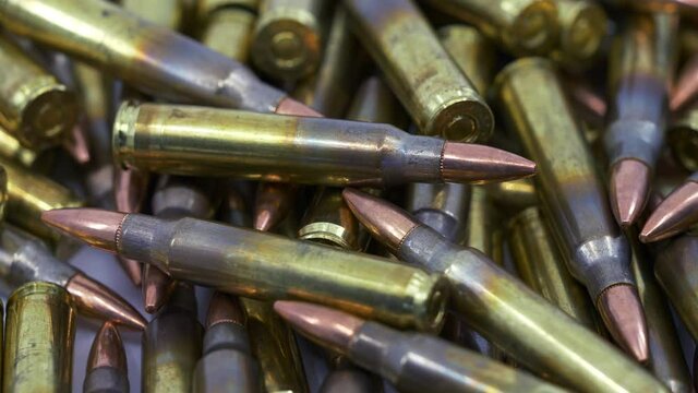 Close Up of Rifle 5.56 Reloaded Ammunition Pile Rotating