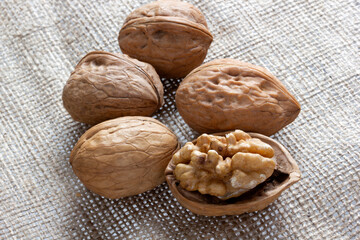Fresh walnuts on burlap. Healthy food.