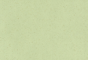 Recycled beige, light green paper background with inclusions of small natural fibers. Extra large highly detailed image.