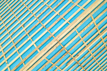 Top down detail of a wooden roof frame on a house under construction.
